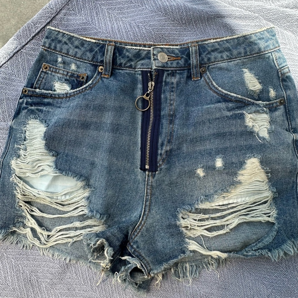 Zip up destroyed high waisted denim shorts